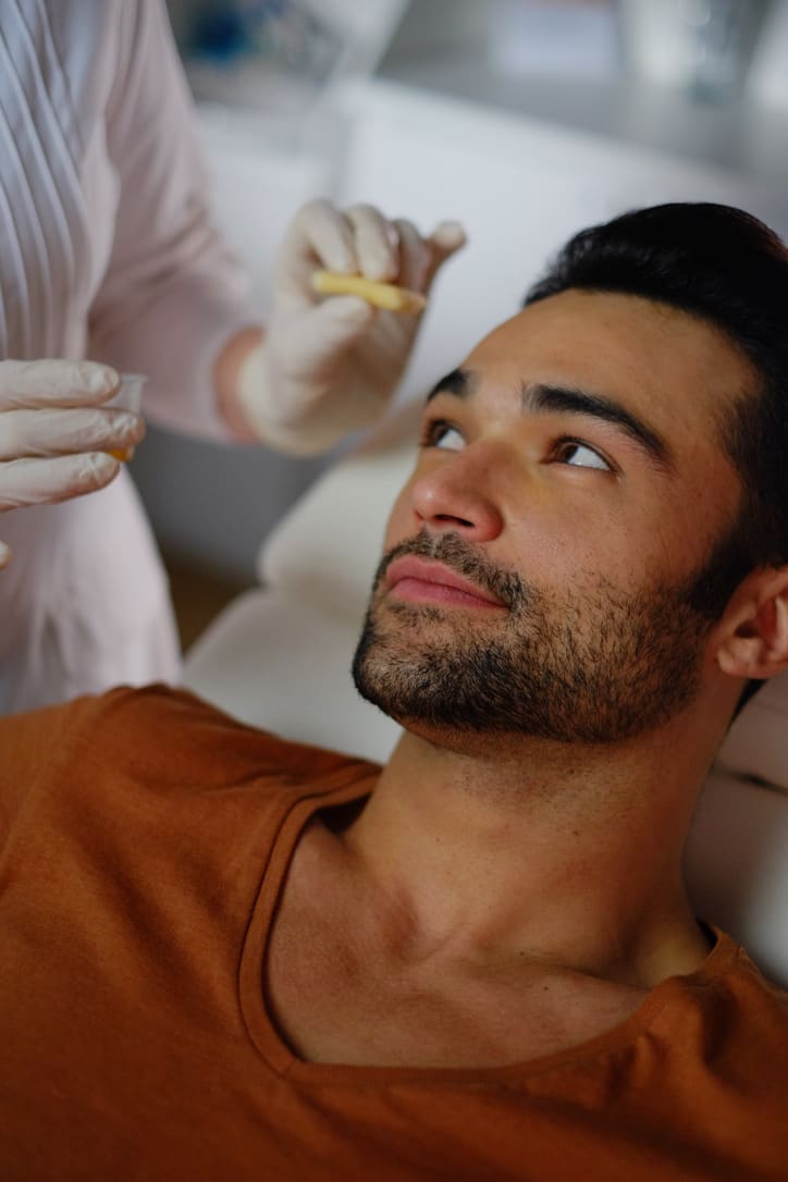 Patient receiving professional aesthetic treatment from trained aesthetic nurse demonstrating aesthetic nursing excellence